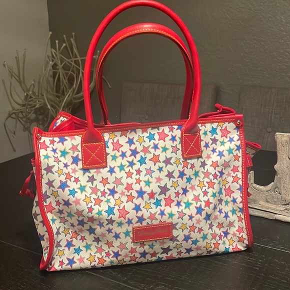Dooney & Bourke Handbags - Dooney & Bourke beautiful stars shoulder bab. In almost new condition. VeryRare